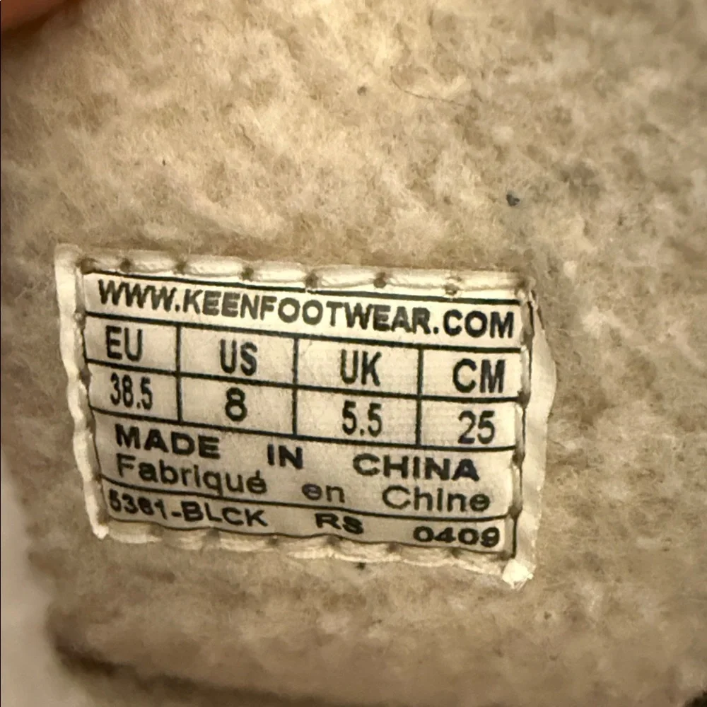 Black Shearling-Trim Winter Boots with Toggle Accents
